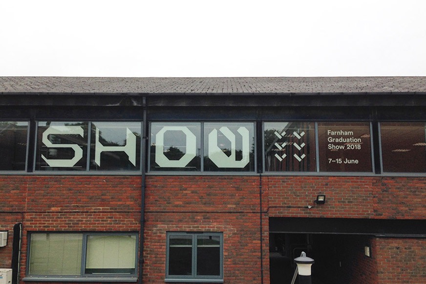 Large window vinyl graphics with bespoke typographic characters spelling out the word 'Show'.