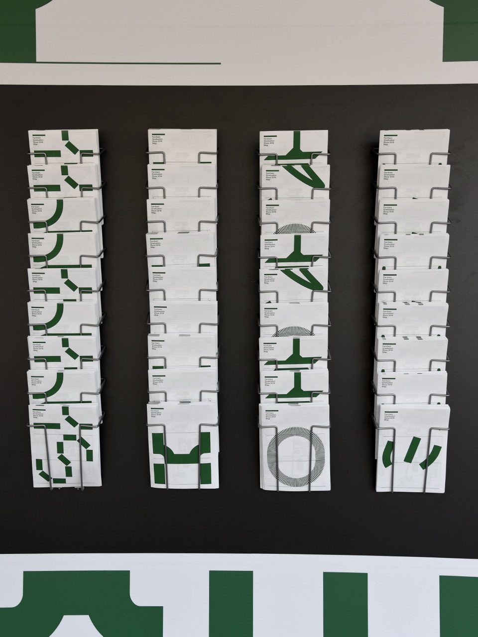 Printed fold out maps spelling out the word Show.