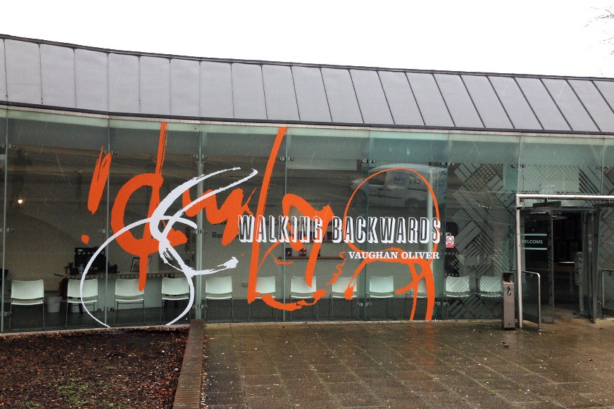 UCA Epsom front window large scale glass graphic installation designed in collaboration with Vaughan Oliver.