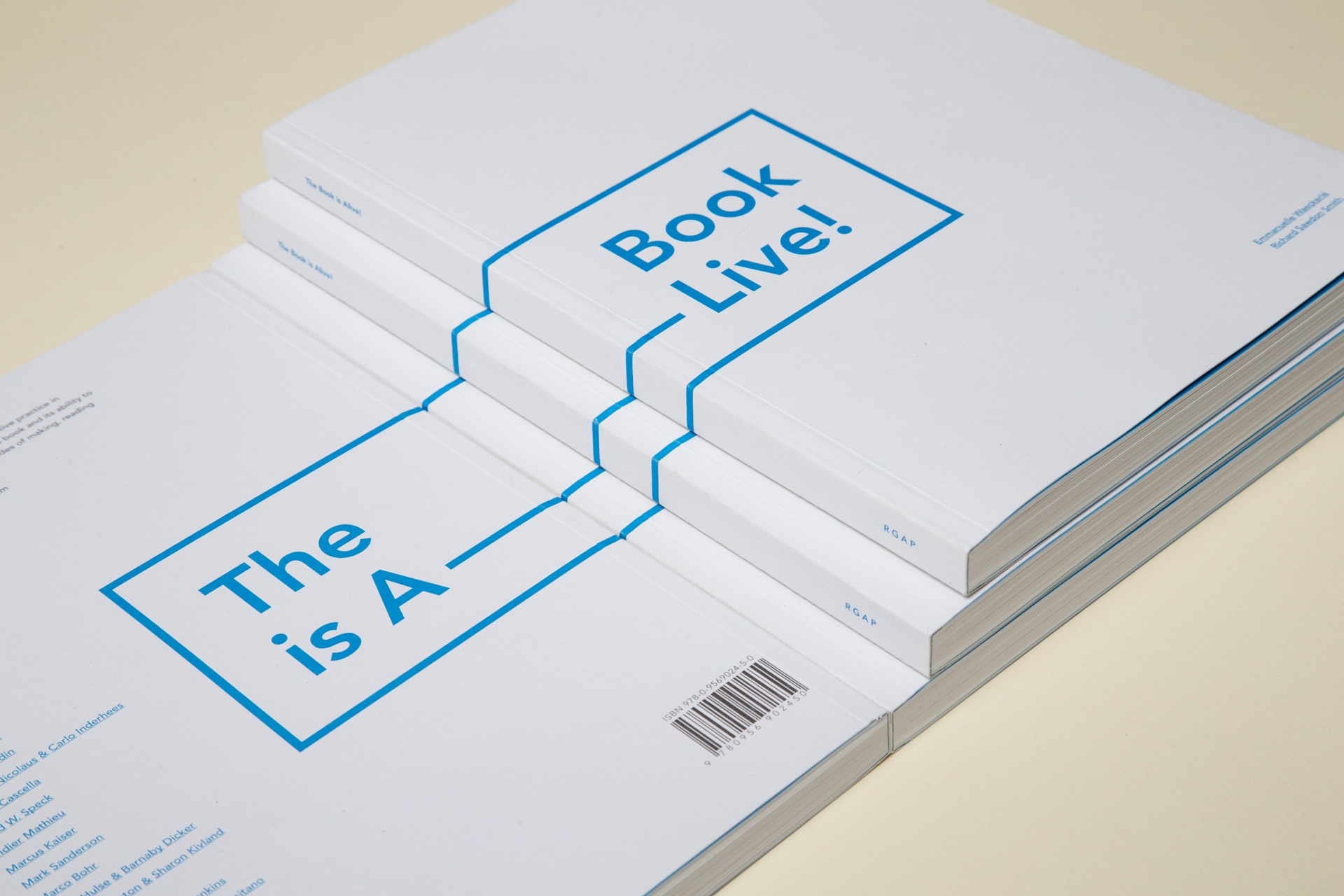 The front & reverse of the The Book is Alive publication next to each other, showing the continuation of the title from reverse to front.