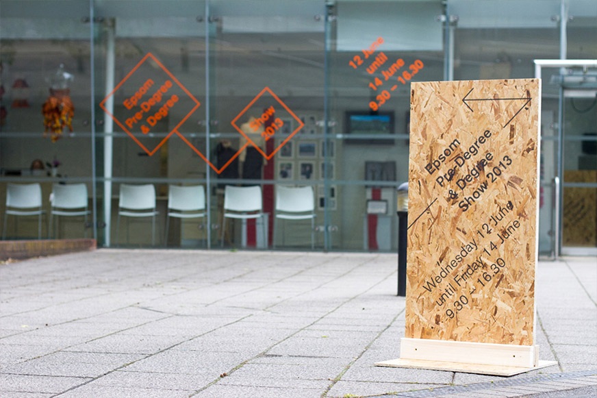 Directional Signage and orange window graphics for UCA Epsom's BA Show 2013