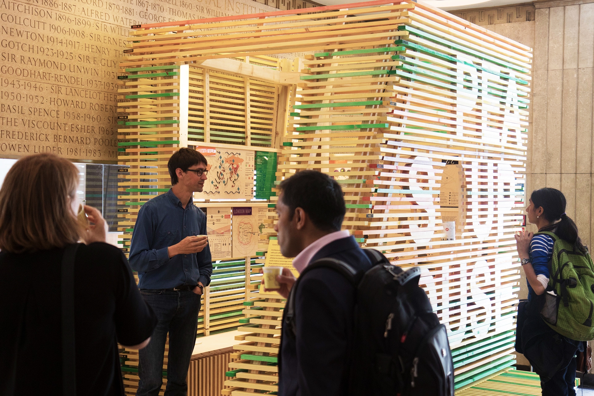 Visitors at the RIBA in London during the opening of the Pea Soup House installation.